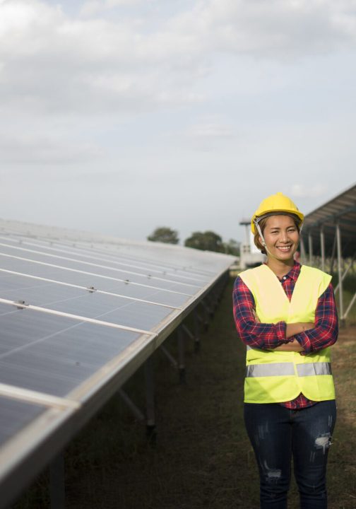 Engineer electric woman checking and maintenance of solar cells.